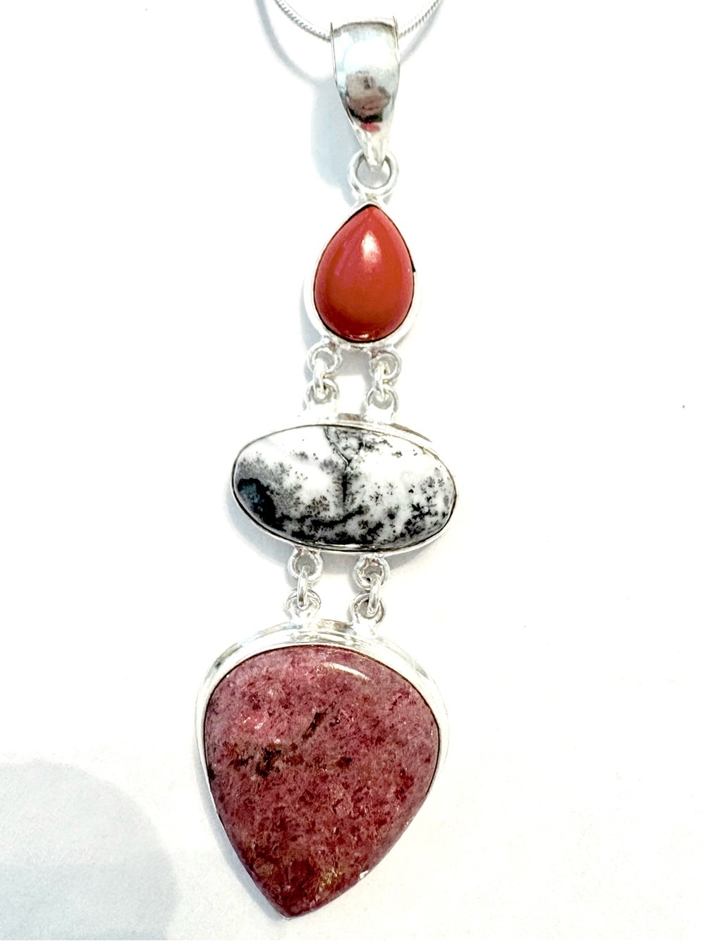 Beautiful, unique, design. Coral,Dendrite Opal, and Rhodonite on the bottom.